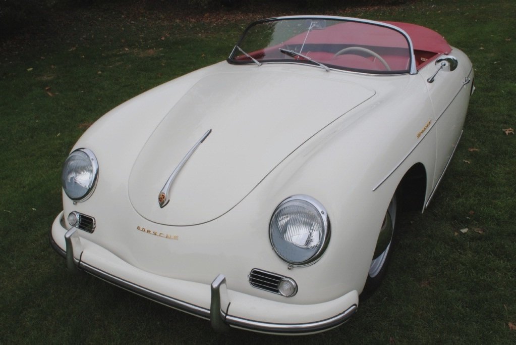 Factory-restored 1957 Porsche 356A Speedster with original paint combo, rebuilt transmission, red interior, and pristine gaps.