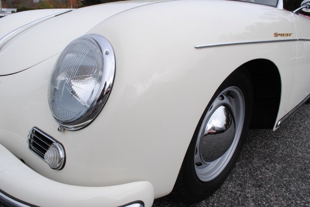 Beautifully restored 1957 Porsche 356A Speedster with authentic white finish, new rubber seals, and red leather factory-correct seats.