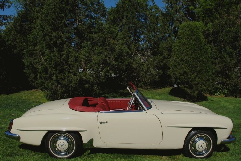 Iconic 1959 Mercedes-Benz 190SL Roadster with factory Ivory exterior rebuilt to perfection for collectors.