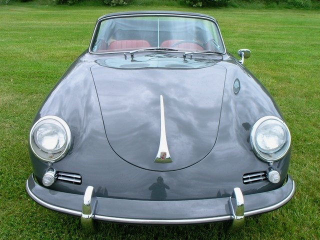 Flawless 1961 Porsche 356B Cabriolet, restored to heritage standards in slate grey over a vibrant red interior finish.